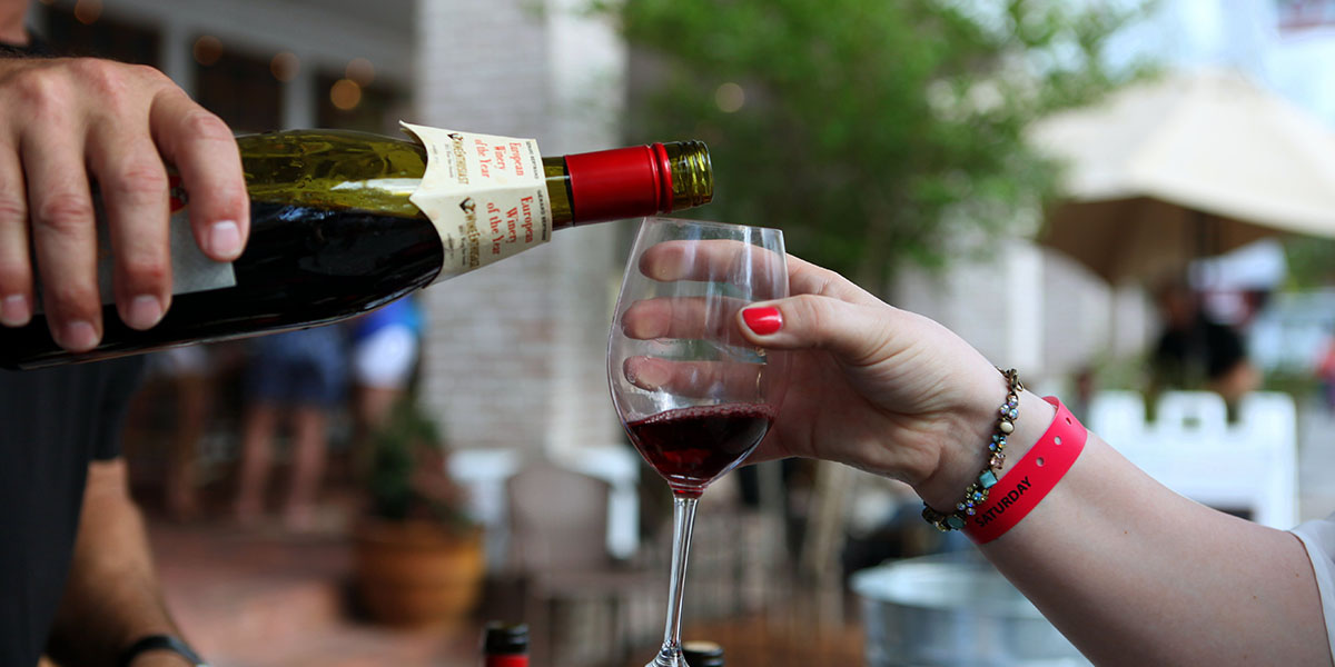 Pouring Glass of Red Wine at Sandestin Wine Festival