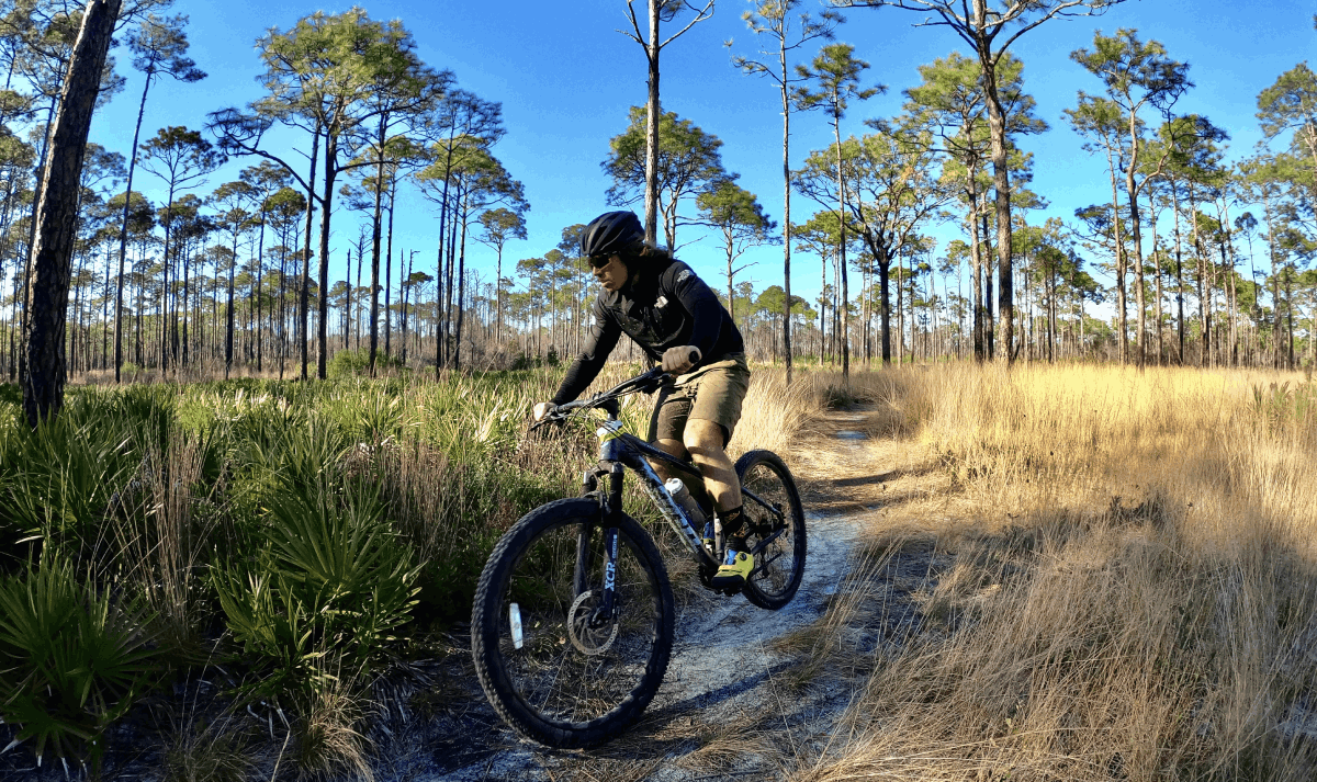 Zach Miller Biking on the Timpoochee Trail